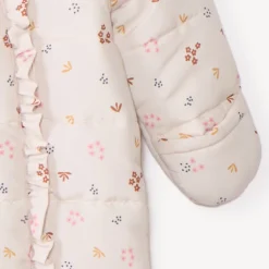 Combi-pilote imprimé fleurs pour bébé fille avec finitions différentes selon l'âge