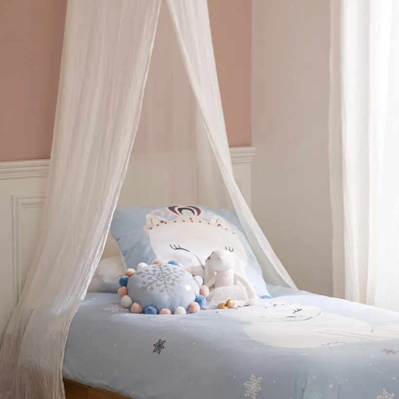 Coussin décoratif à pompons Flocon