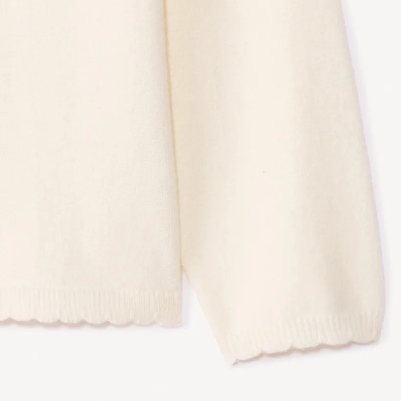 Gilet en tricot uni festonné pour bébé fille