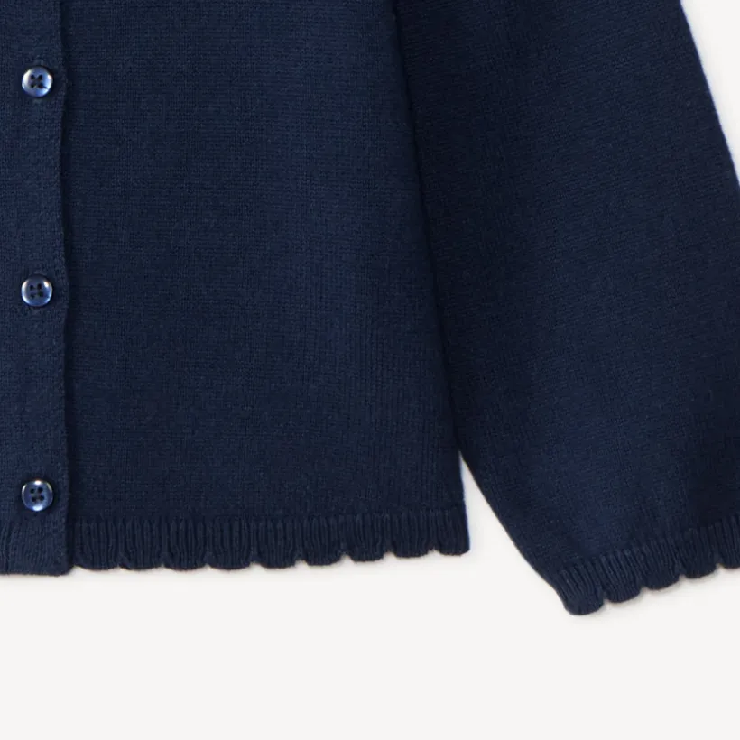 Gilet en tricot uni festonné pour bébé fille