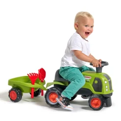 Porteur tracteur Claas Arion 470 avec remorques et outils vert