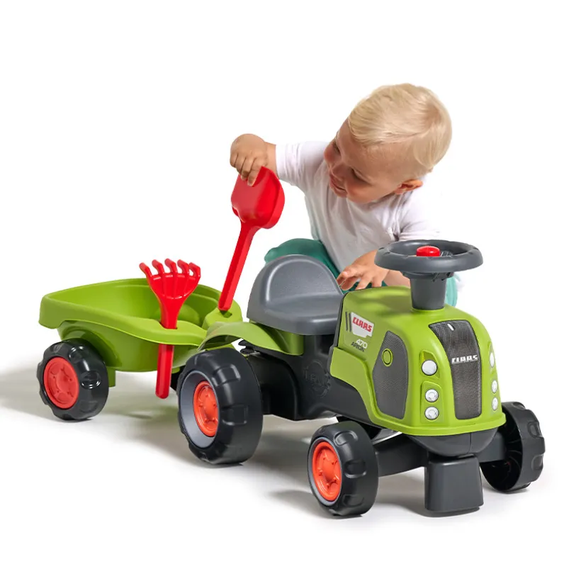 Porteur tracteur Claas Arion 470 avec remorques et outils vert
