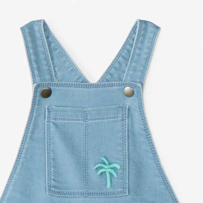 Salopette courte en jean style workwear avec broderie palmier pour bébé garçon